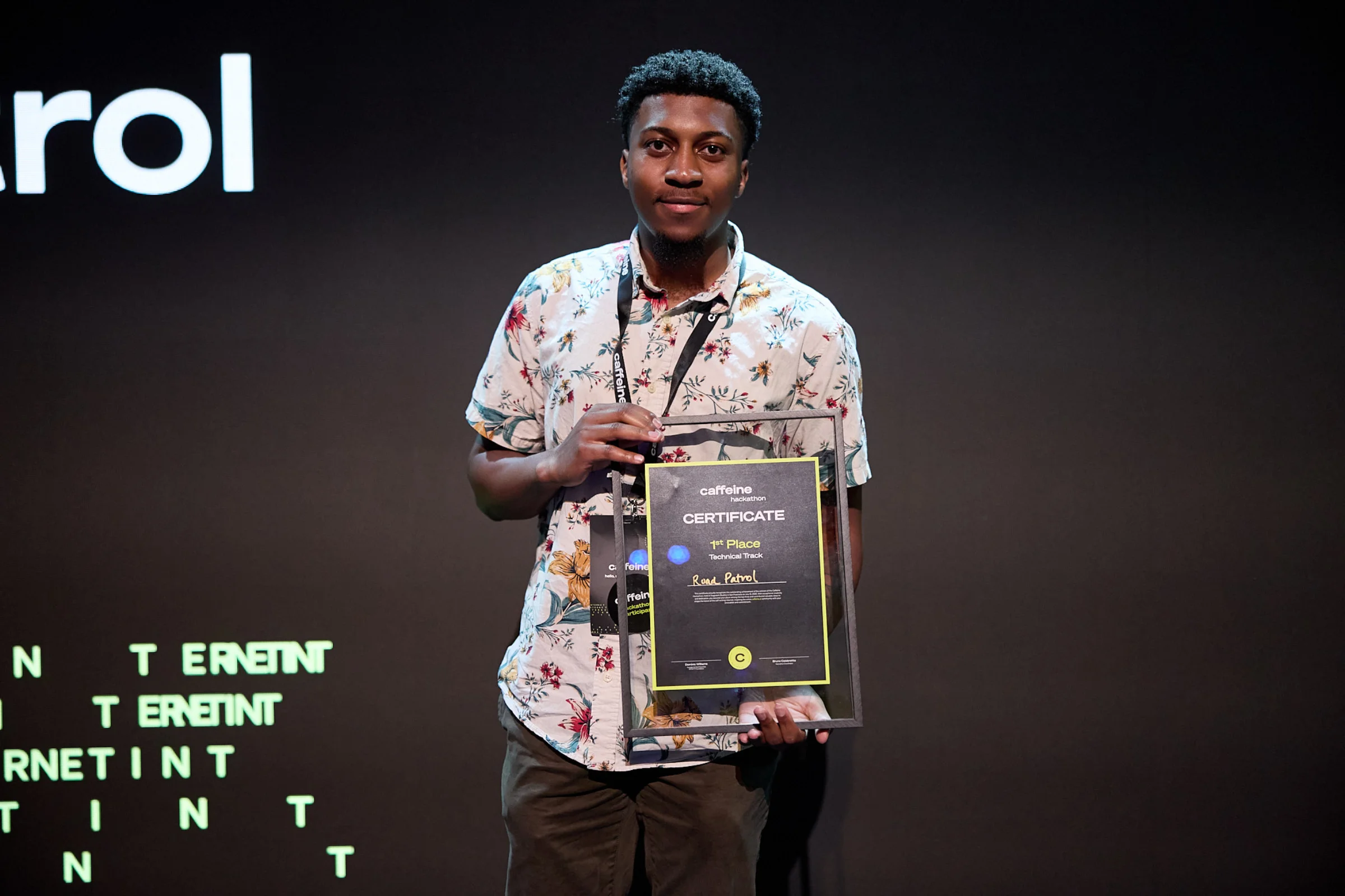 Daryl holding the hackathon award